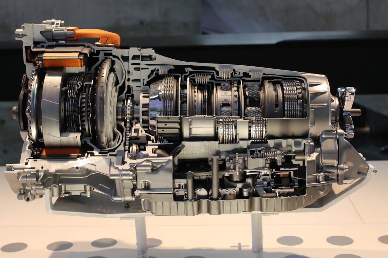 Services Detailed view of a car transmission cutaway, showcasing internal mechanisms.